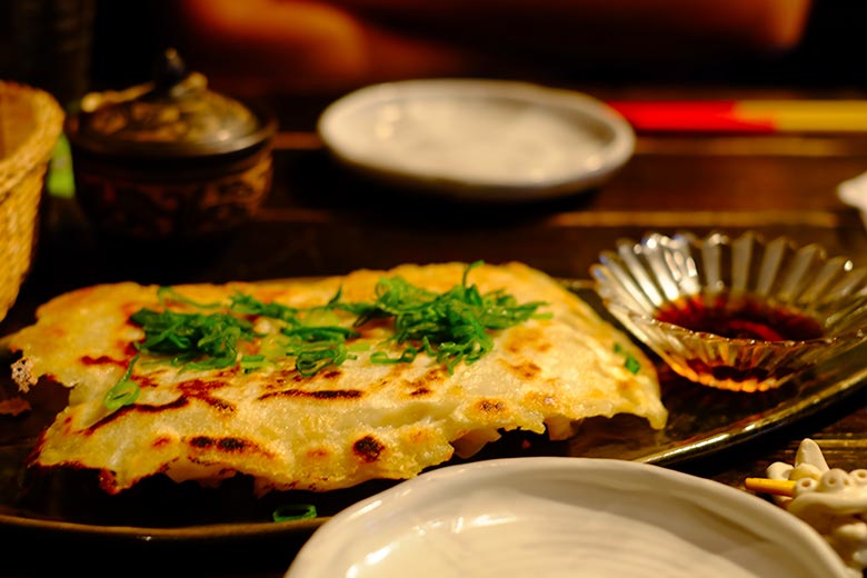 The chopstick rest is shaped like a Shiisaa, a creature from Ryukyuan mythology resembling a cross between a lion and a dog. The chopstick rest is shaped like a Shiisaa, a creature from Ryukyuan mythology resembling a cross between a lion and a dog.