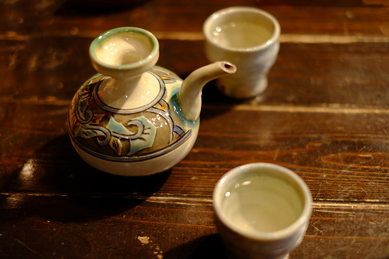 Sake served from a Japanese teapot. Asian Chample Foods, Goya, Kyoto, Japan. Sake served from a Japanese teapot. Asian Chample Foods, Goya, Kyoto, Japan.