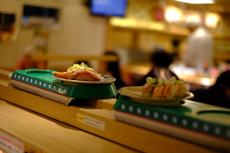 At conveyor belt sushi restaurants, you can still order specific items off the menu. At this restaurant in Shibuya, Tokyo, the sushi is delivered by a mini-shinkansen (bullet train). At conveyor belt sushi restaurants, you can still order specific items off the menu. At this restaurant in Shibuya, Tokyo, the sushi is delivered by a mini-shinkansen (bullet train).