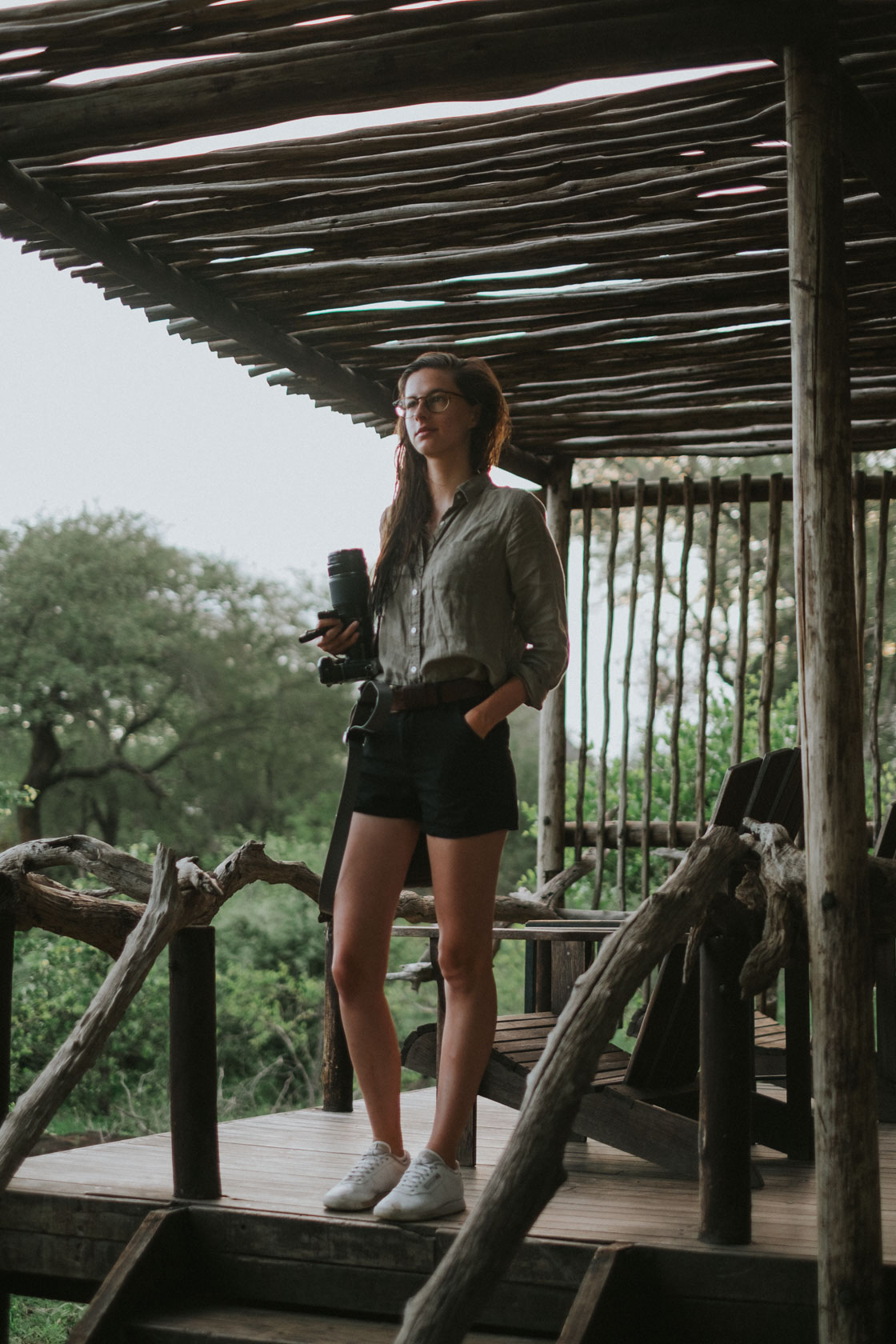 Girl with large camera lens